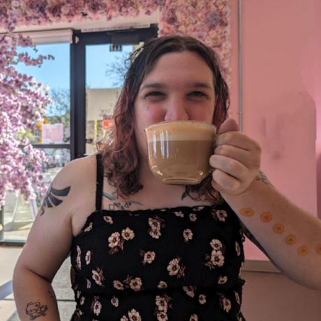 Hannah enjoying a cup of coffee